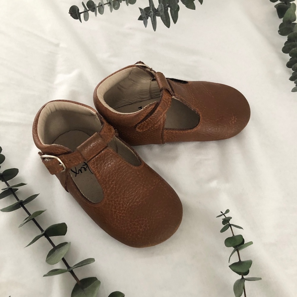 Monkey feet leather t-strap shoes